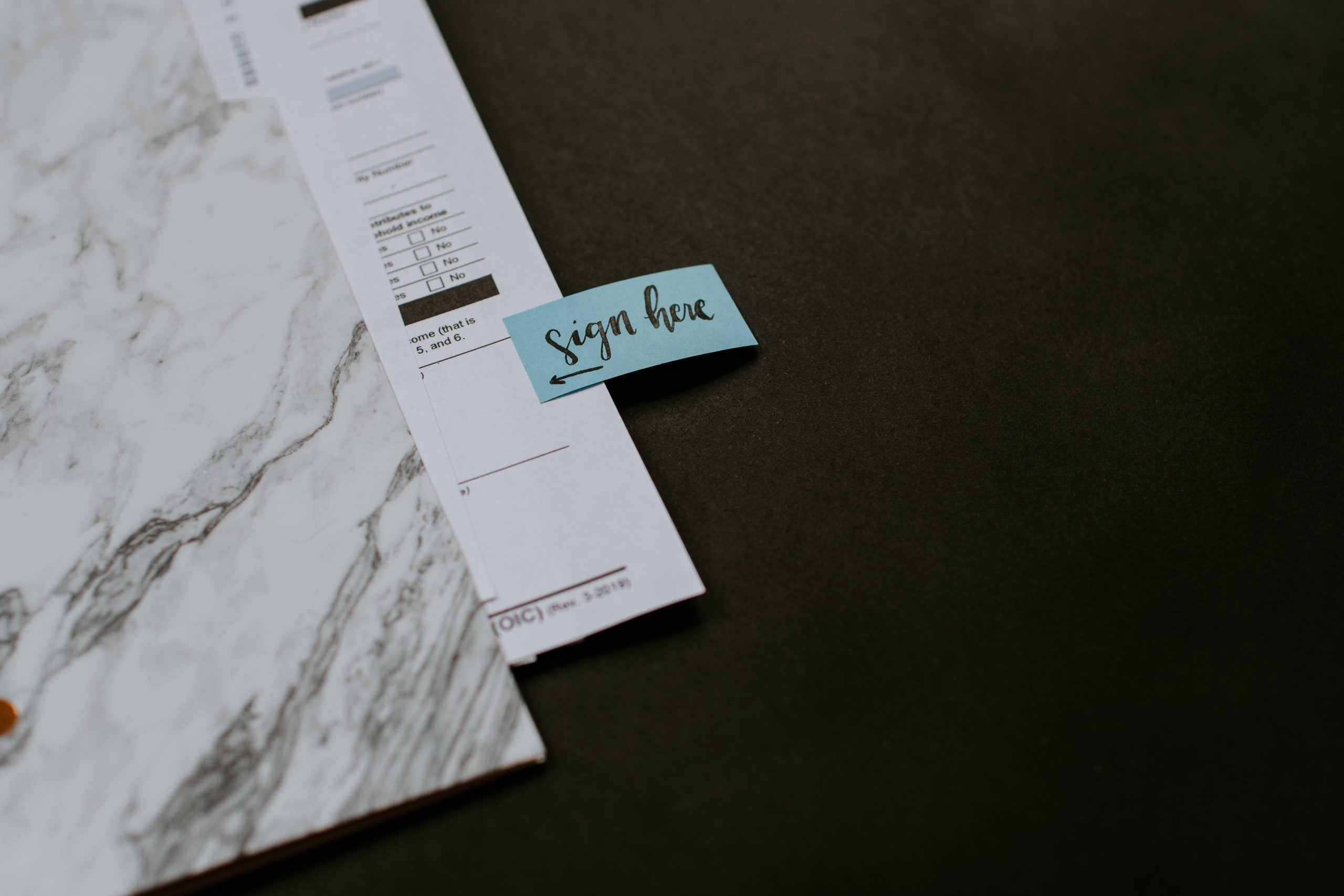 Marble Folder With Paperwork And A Blue 