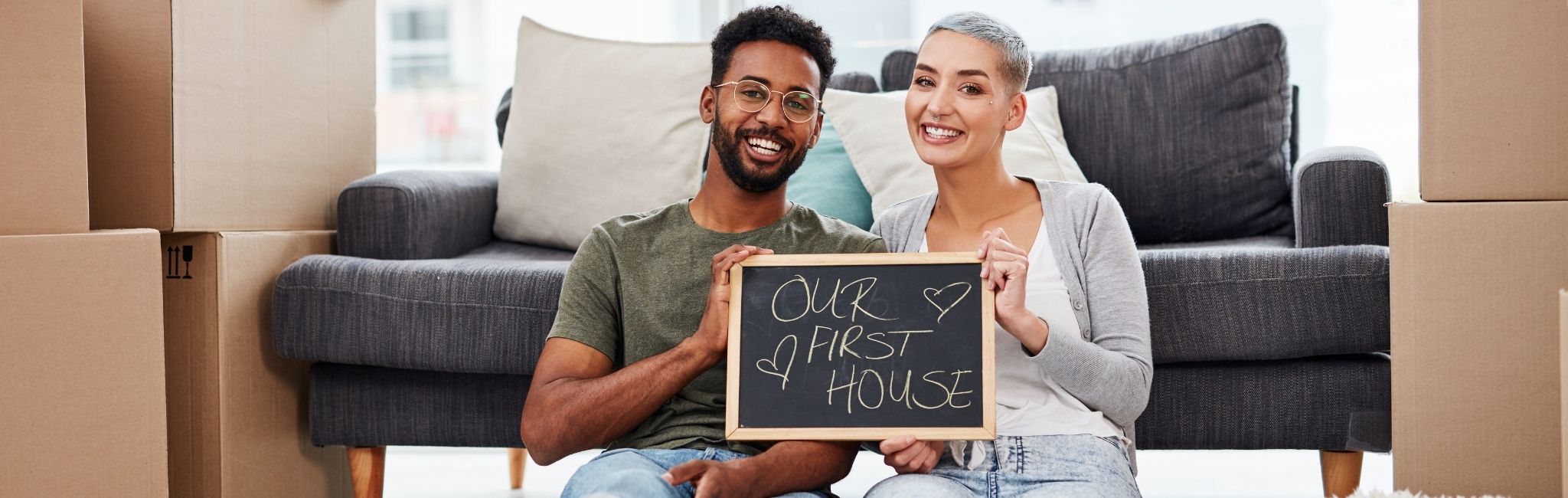 First-time homebuyers reviewing mortgage options with HUNT Mortgage